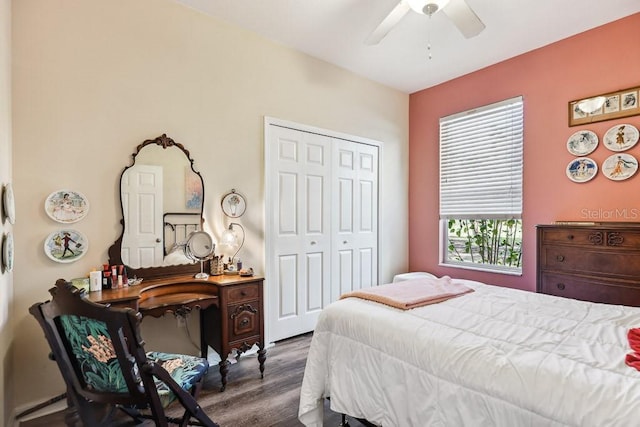 bedroom with ceiling fan, a closet, and dark wood-type flooring