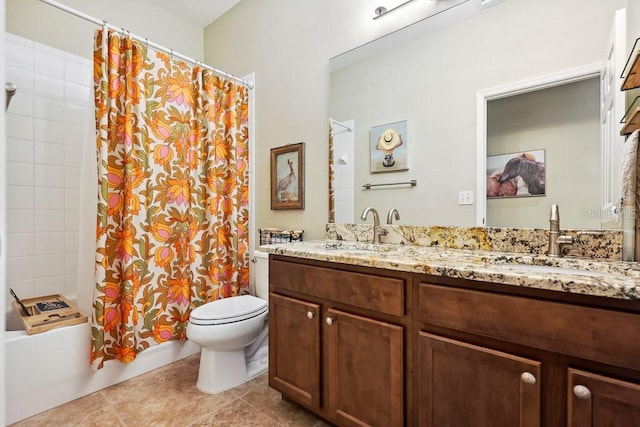 full bathroom featuring toilet, vanity, tile patterned flooring, and shower / bath combination with curtain