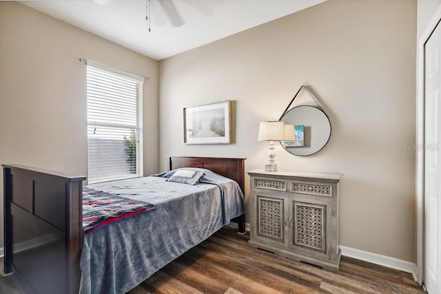 bedroom featuring ceiling fan and dark hardwood / wood-style flooring