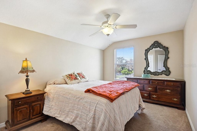 bedroom featuring ceiling fan, carpet, and lofted ceiling