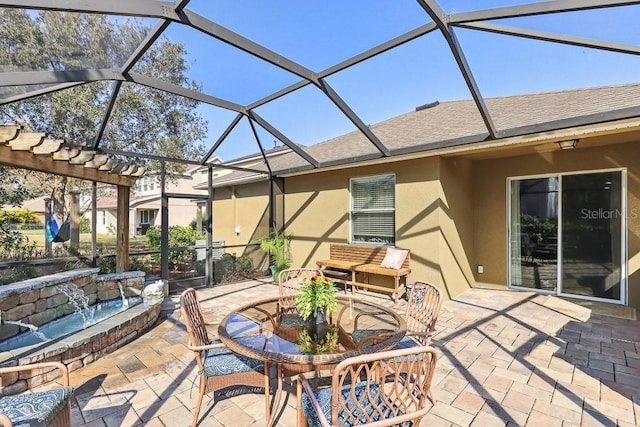 view of patio / terrace featuring pool water feature, a hot tub, and a lanai