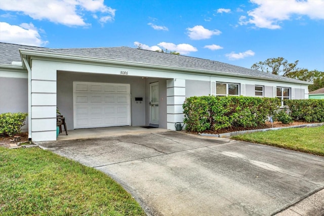 ranch-style house featuring a garage and a front yard