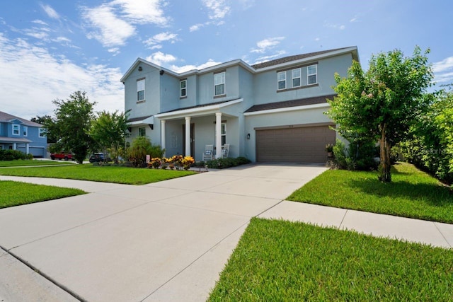 view of front facade featuring a front yard and a garage