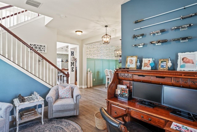 office featuring hardwood / wood-style floors and a notable chandelier