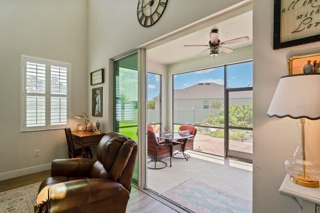 interior space with light hardwood / wood-style floors, ceiling fan, and a healthy amount of sunlight