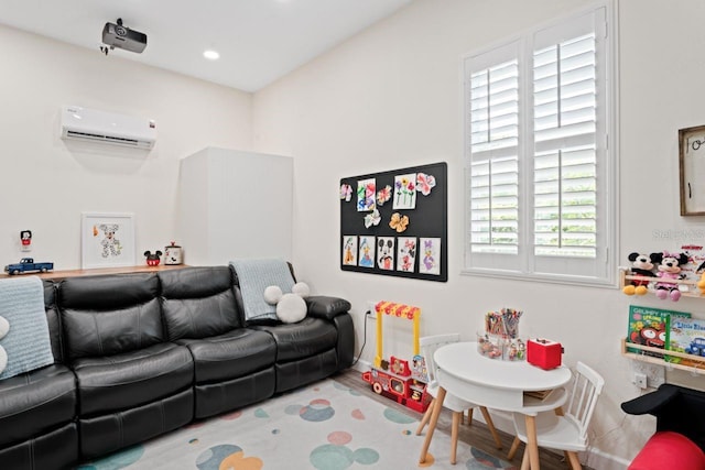 playroom featuring a wall mounted AC