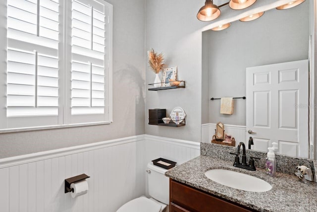 bathroom with toilet and vanity