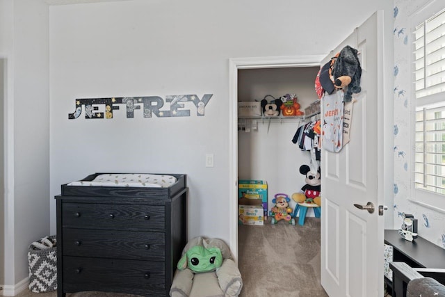 carpeted bedroom featuring multiple windows