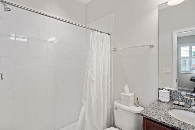 bathroom with a shower with curtain, toilet, and vanity