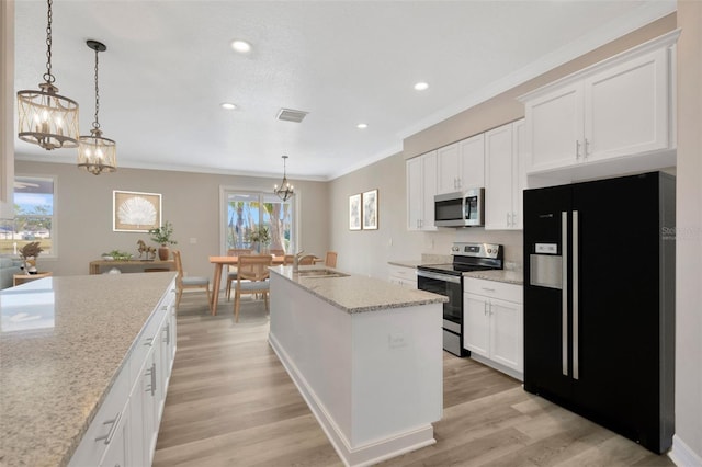 kitchen featuring stainless steel appliances, white cabinetry, sink, and an island with sink