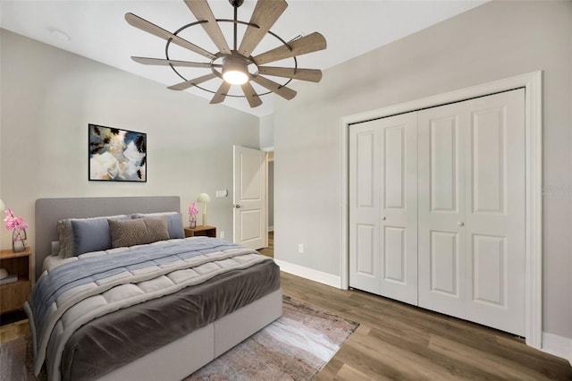 bedroom featuring a closet, ceiling fan, and wood-type flooring