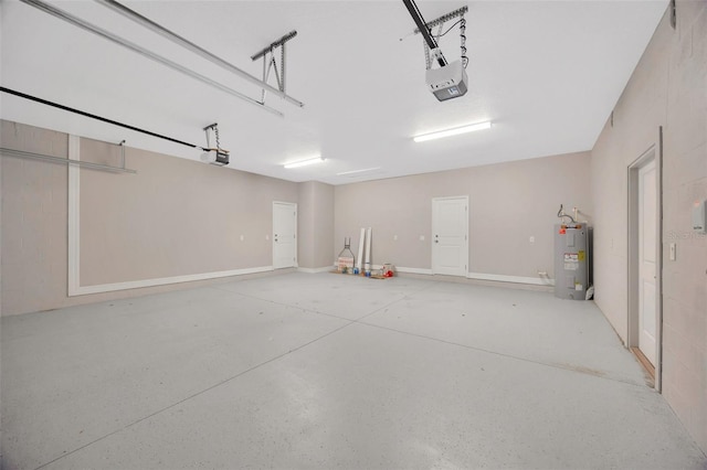 garage featuring a garage door opener and water heater