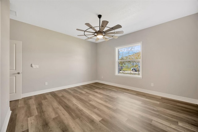 unfurnished room featuring ceiling fan and wood-type flooring