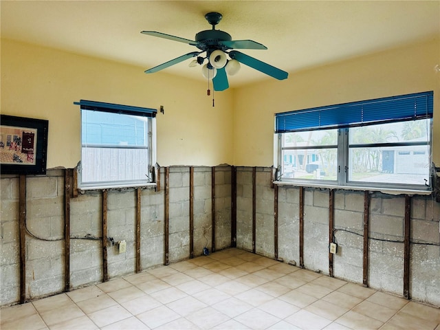 basement featuring ceiling fan