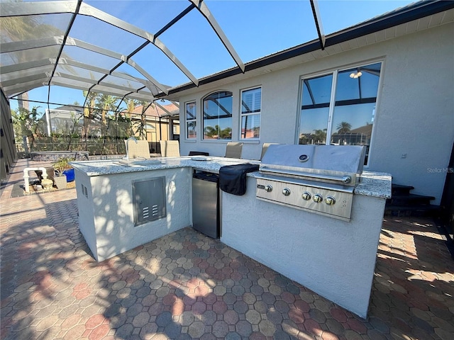 view of patio / terrace featuring area for grilling, a lanai, and grilling area