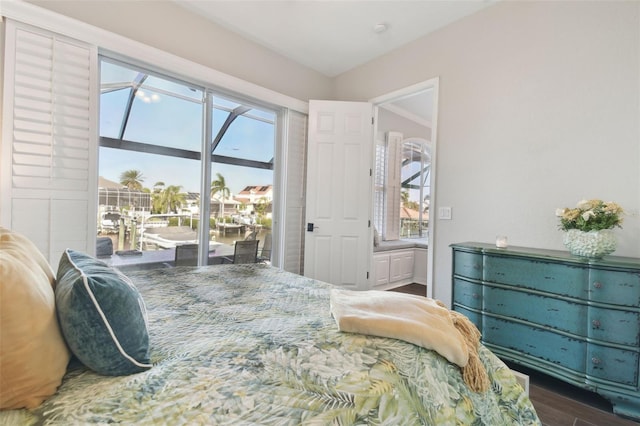 bedroom with dark wood-type flooring and access to outside