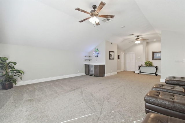 carpeted living room featuring lofted ceiling