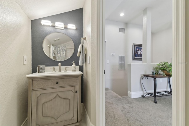 bathroom featuring vanity and a textured ceiling