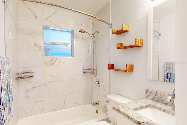 full bathroom with toilet, vanity, and tiled shower / bath combo