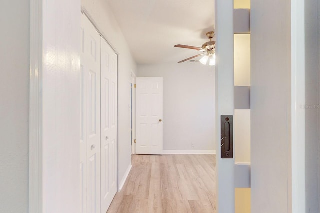 hall with light wood-type flooring