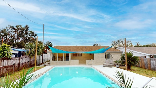 view of swimming pool featuring a patio