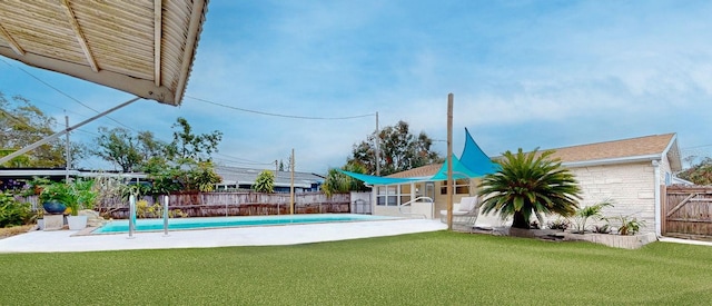 view of pool with a lawn