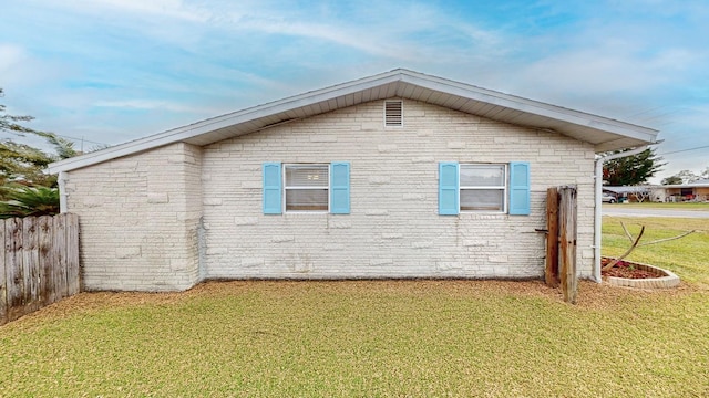 view of property exterior featuring a yard