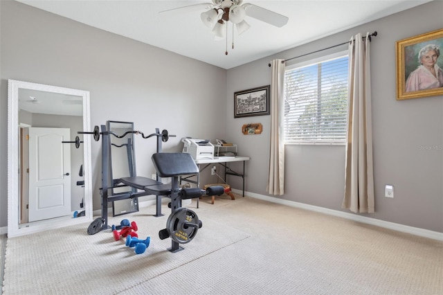 exercise room featuring ceiling fan and light colored carpet