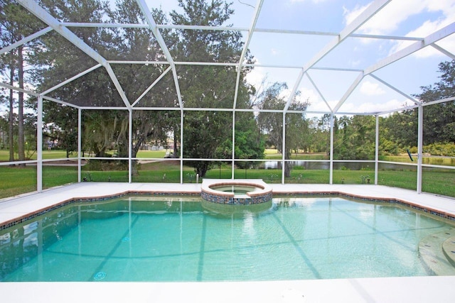 view of swimming pool with glass enclosure, a yard, and an in ground hot tub