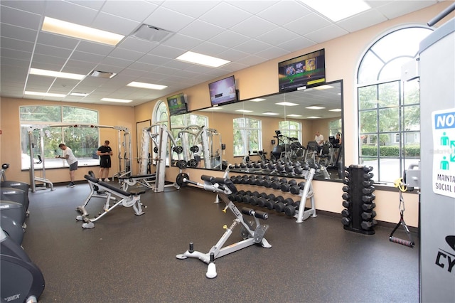 gym featuring a drop ceiling