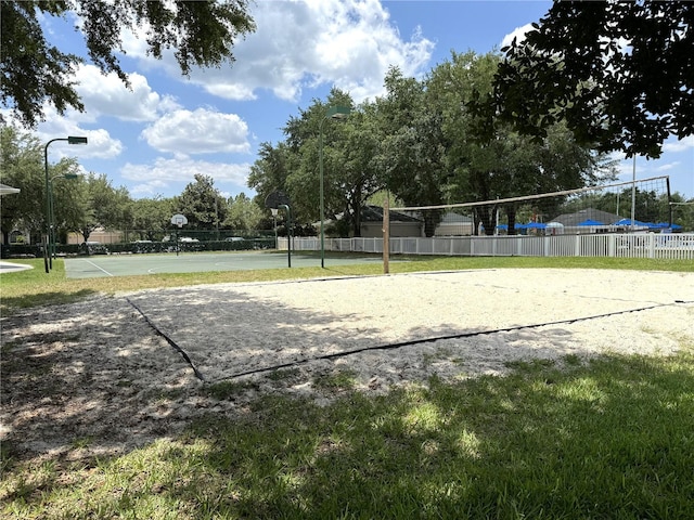 surrounding community featuring volleyball court and basketball hoop