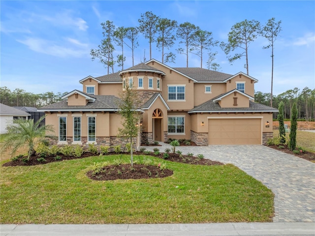 craftsman house featuring a garage and a front lawn