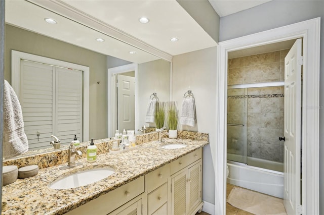 bathroom with vanity, tile patterned flooring, and shower / bath combination with glass door