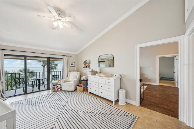 bedroom with ceiling fan, vaulted ceiling, access to outside, light tile patterned flooring, and ornamental molding