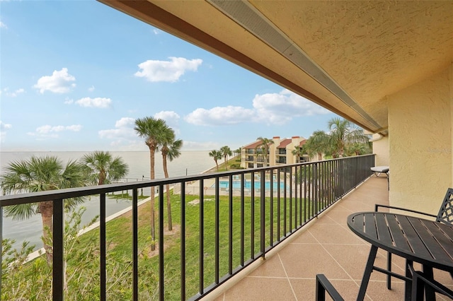 balcony featuring a water view