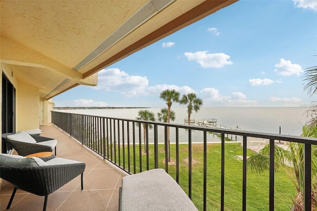 balcony featuring a water view