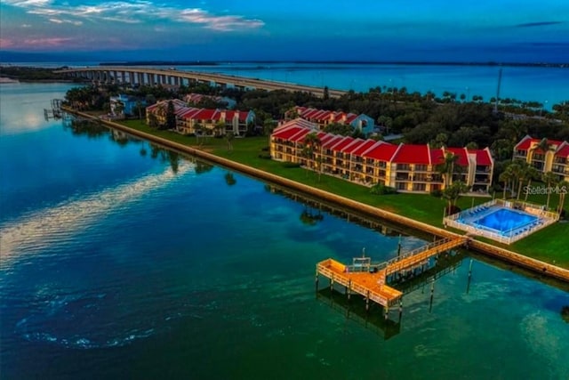 aerial view at dusk with a water view