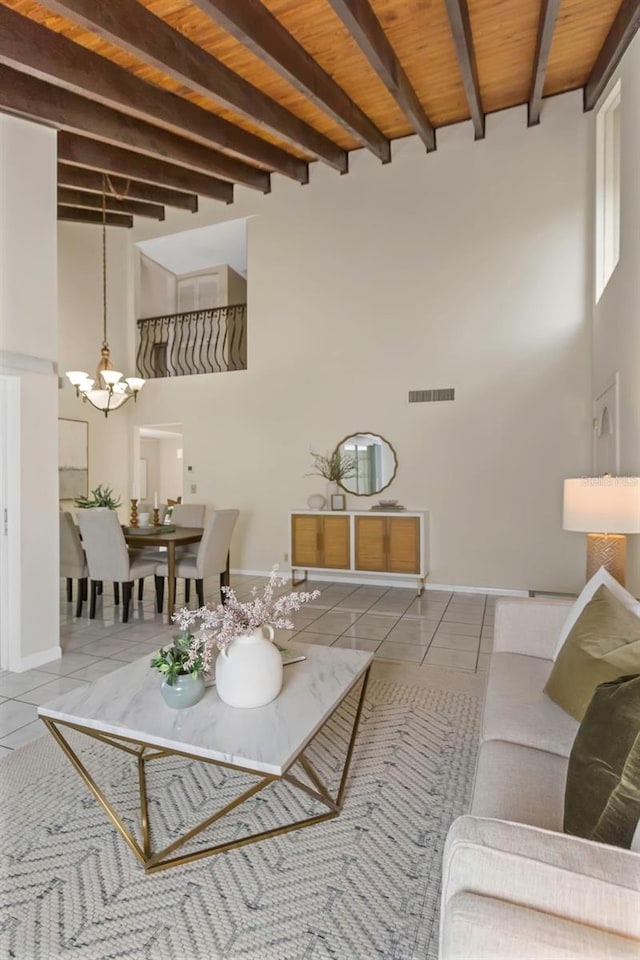 tiled living room with wood ceiling, beam ceiling, and a notable chandelier