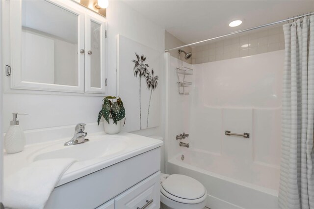 full bathroom featuring toilet, vanity, and shower / tub combo