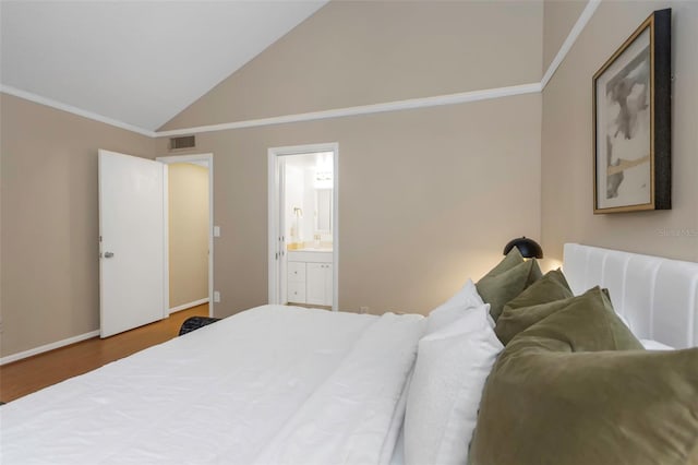 bedroom with hardwood / wood-style flooring, connected bathroom, high vaulted ceiling, and ornamental molding