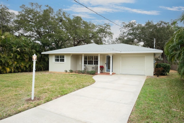 ranch-style house featuring a garage and a front yard