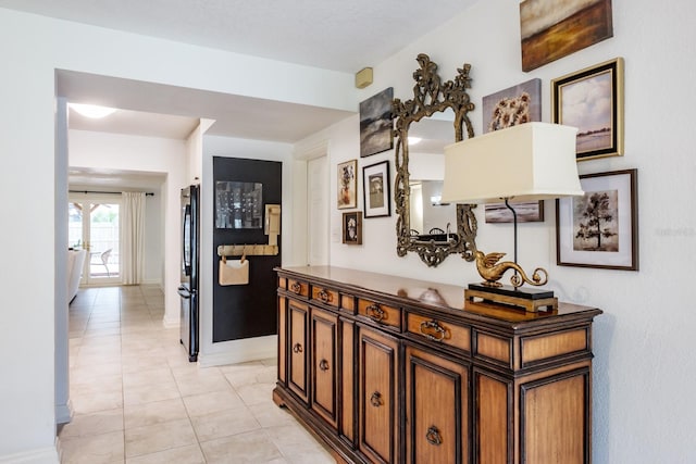 hallway featuring light tile patterned floors