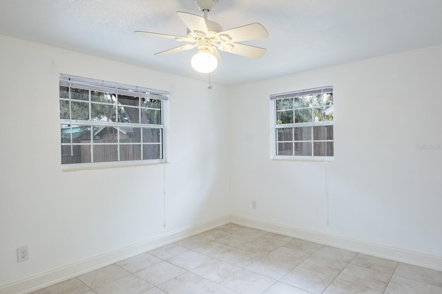 spare room with ceiling fan