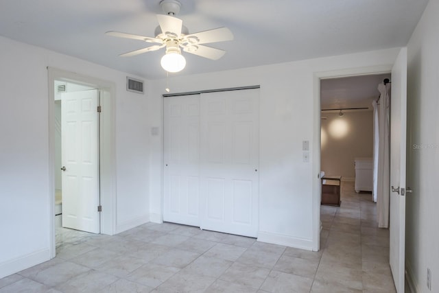 unfurnished bedroom featuring a closet and ceiling fan