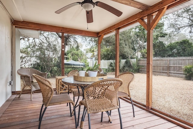 sunroom featuring ceiling fan