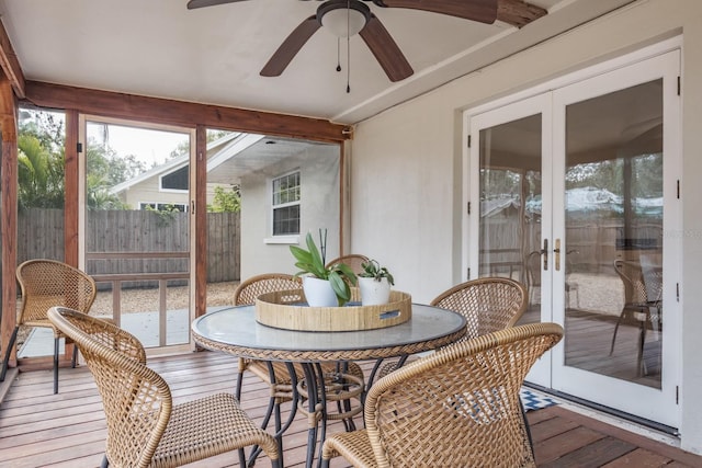 sunroom with ceiling fan and french doors