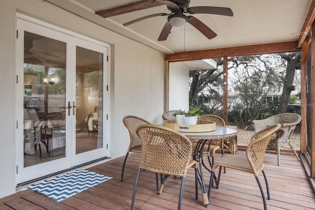 sunroom / solarium featuring ceiling fan and french doors