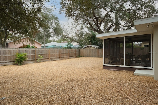 view of yard with a sunroom