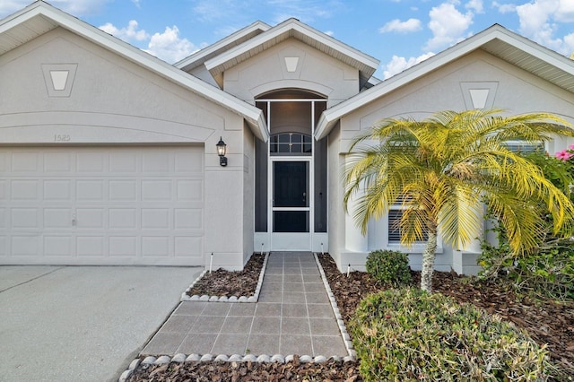 view of exterior entry featuring a garage