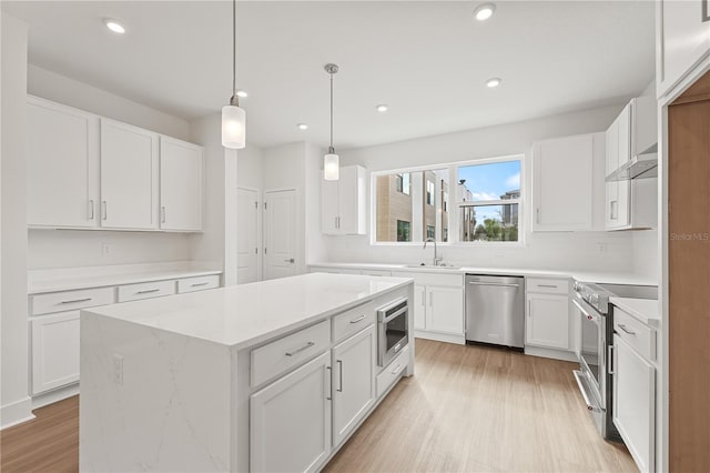 kitchen with white cabinets and appliances with stainless steel finishes